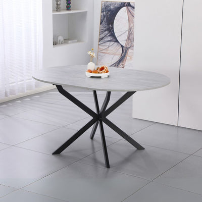 Tavolo rotondo allungabile Rut con piano colore cemento e gambe in metallo nero