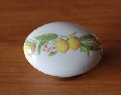 Ovalino ceramica art.150 bianco base bronzata